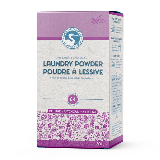 A box of laundry powder with branding and text indicating it is a natural cleaning product with citrus scent.