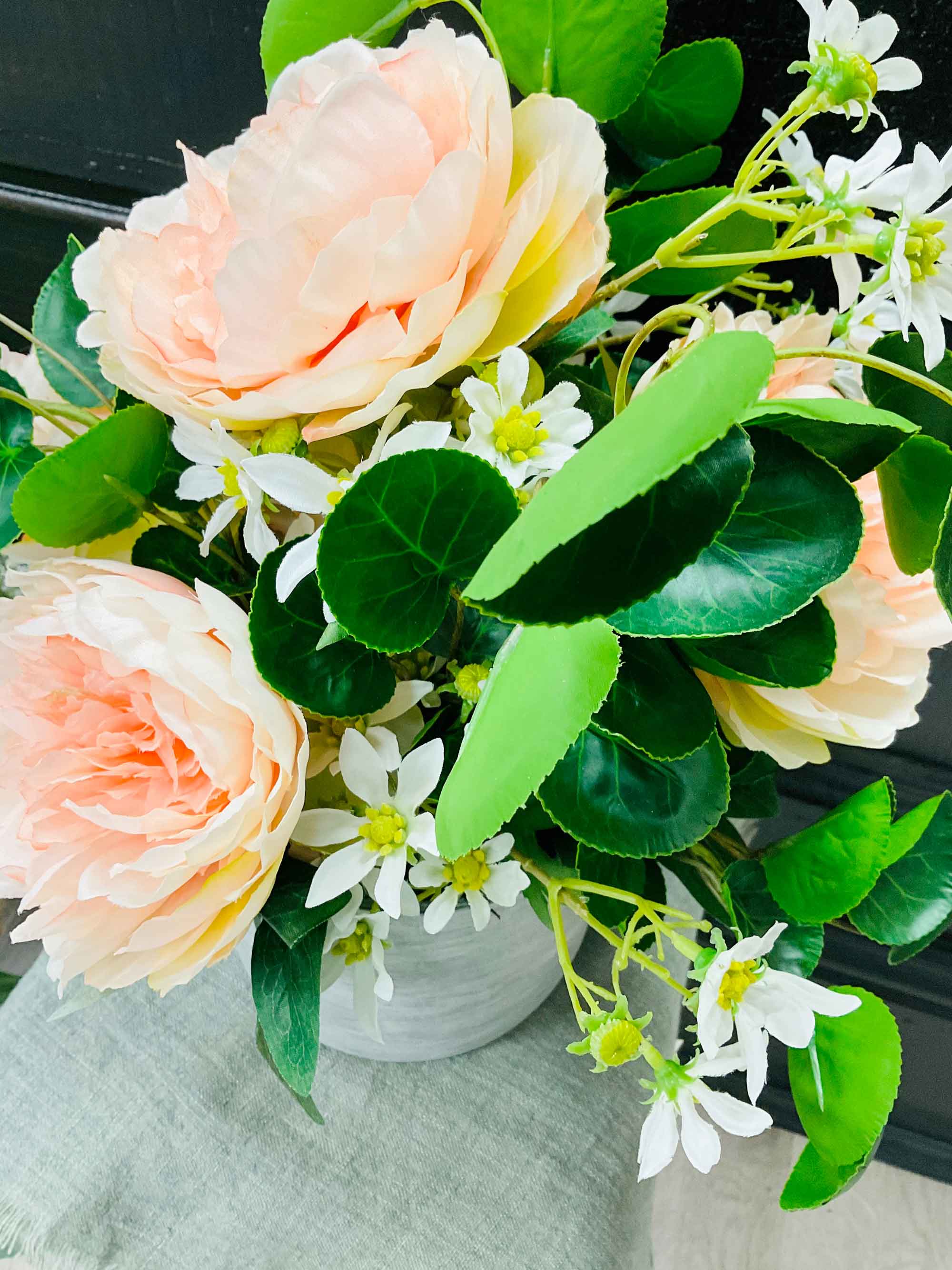 two-pick-flowers-in-a-grey-vase