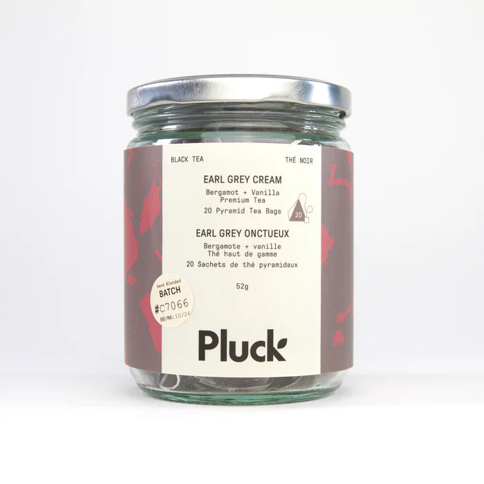 Jar of Pluck tea with a label on a white background